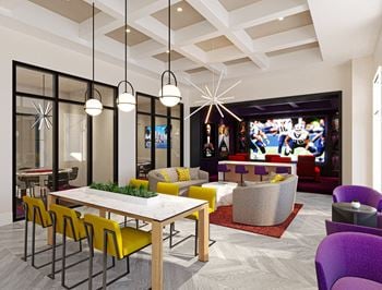 A rendering of a clubhouse with a large tv in the background and a table with yellow chairs
